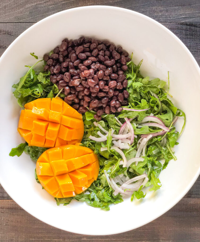 Mango black bean arugula salad