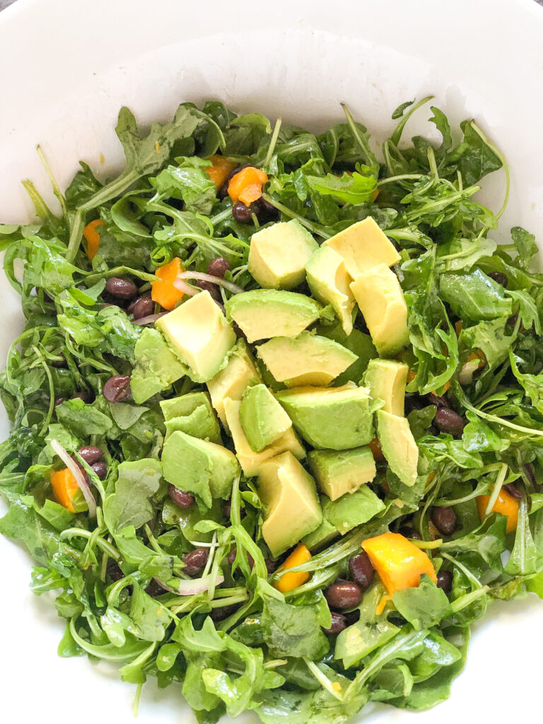 Mango black bean arugula salad